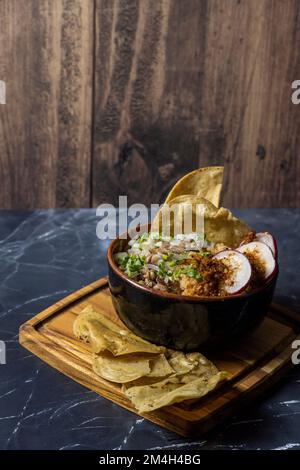mexican food meat bowl, with meat juice cilantro and onion on the cover, mexican wooden plates Stock Photo