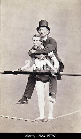 The Brothers Alinari - Charles Blondin - tightrope walker with balance pole and giving a well dressed gentleman a piggy-back Stock Photo