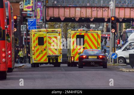 London, UK. 21st December 2022. Ambulances pass in central London, as thousands of ambulance workers and paramedics begin their strike in a dispute over pay and conditions. Credit: Vuk Valcic/Alamy Live News Stock Photo