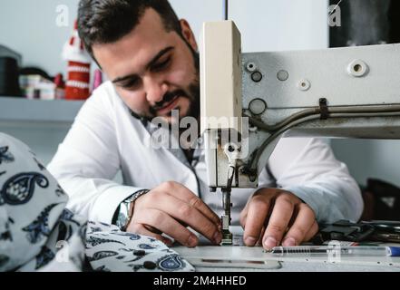 Tailor Man sewing Stock Photo