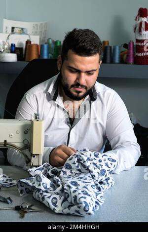 Tailor Man sewing Stock Photo