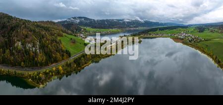 Lac Brenet, Lac de Joux in the back, drone shot in late autumn, Vallee de Joux, Vaud, Switzerland Stock Photo