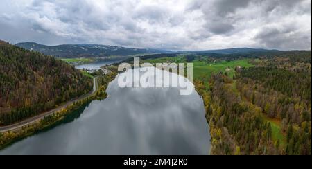 Lac Brenet, Lac de Joux in the back, drone shot in late autumn, Vallee de Joux, Vaud, Switzerland Stock Photo