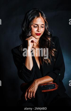 Portrait young woman with long hair and red lips Stock Photo
