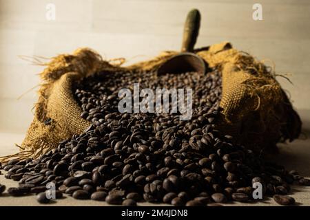 Bulk coffee in burlap bag with scoop Stock Photo