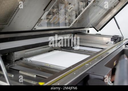 White polyamide powder on working surface of open 3D printer. White polyamide powder in working chamber of open powder 3D printer for industrial use. Modern printing technology. Multi Jet Fusion MJF Stock Photo