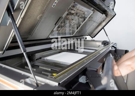White polyamide powder on working surface of open 3D printer. White polyamide powder in working chamber of open powder 3D printer for industrial use. Modern printing technology. Multi Jet Fusion MJF Stock Photo