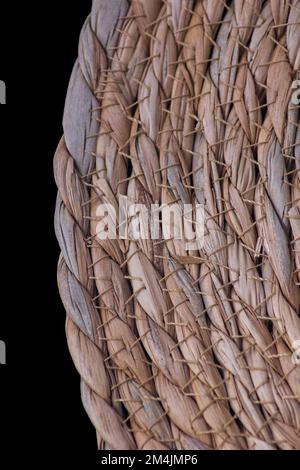 wicker placemat on black background ( close-up shot ) Stock Photo