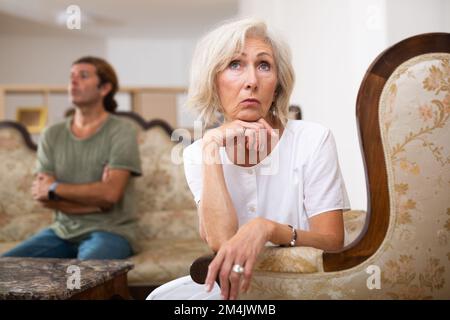 Quarrel between husband and wife in apartment Stock Photo