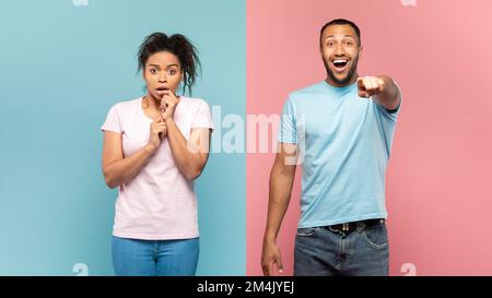 Shocked black couple gaze straightly at camera, happy man pointing at something, impressed woman looking with excitement Stock Photo