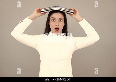 Funny surprised student inspiration creativity, solution. Eureka, idea. Portrait of excited young woman having wow creative idea, studio background Stock Photo