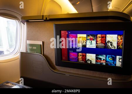 San Francisco, California, USA, 10 December, 2022: Modern airplane interiors, luxury first class and business class seats with entertainment area Stock Photo