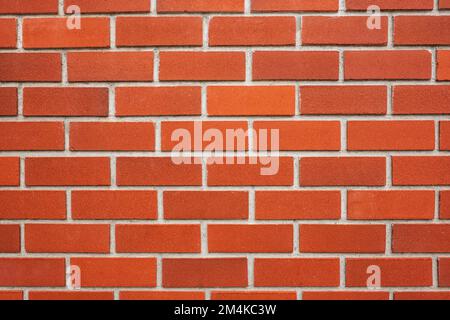 Beautiful red brick wall, details. New brick wall pattern background. Nobody, street photo, copyspace for text Stock Photo