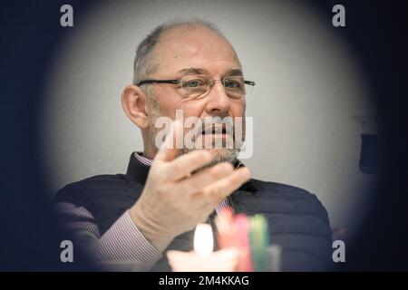 Berlin, Germany. 12th Dec, 2022. Pastoral counselor Uwe Müller from the Church Telephone Counseling Service in Berlin and Brandenburg sits in his office at the Diakonie Volunteer Center. Demand for telephone counseling is particularly high at Christmas. Credit: Jens Kalaene/dpa/Alamy Live News Stock Photo