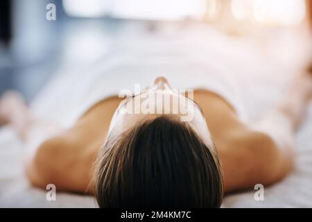 Be still and enjoy. an attractive young woman getting pampered at a beauty spa. Stock Photo