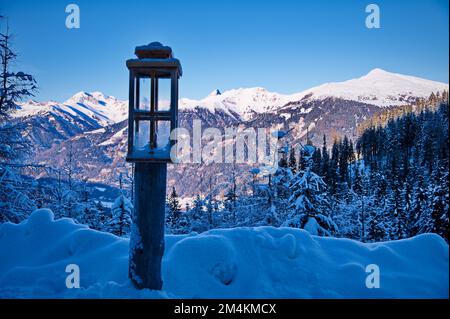 Beautiful winter landscape with lantern in front, Austria Stock Photo