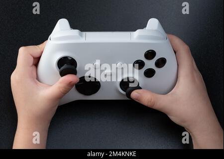 Close up of playing kid in computer game on black background Stock Photo