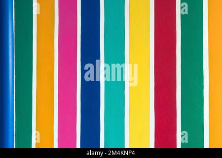 Multicolor vertical striped pattern on cement wall. Colorful painted on cement surface of the wall. Graffiti in the colors of rainbow. Colour full of Stock Photo