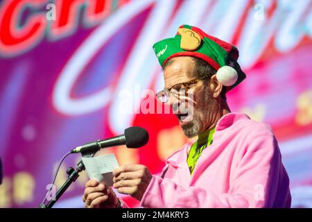 Bensalem, United States. 21st Dec, 2022. Gary Lauer announces a contestant as part of WMMR Radio's Ugly Christmas Sweater contest Wednesday, December 21, 2022 at PARX Xcite Center in Bensalem, Pennsylvania. The winner of the contest receives a year supply of beer. Credit: William Thomas Cain/Alamy Live News Stock Photo