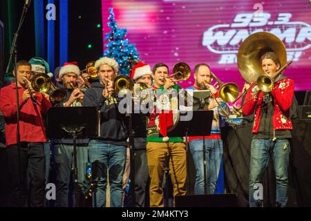 Bensalem, United States. 21st Dec, 2022. The house band performs as part of WMMR Radio's Ugly Christmas Sweater contest Wednesday, December 21, 2022 at PARX Xcite Center in Bensalem, Pennsylvania. The winner of the contest receives a year supply of beer. Credit: William Thomas Cain/Alamy Live News Stock Photo