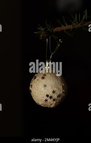 White Christmas globe found in a natural tree Stock Photo