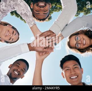 Team hands, face and happy employee support for business success, diversity solidarity and collaboration outdoor. Teamwork, interracial employees and Stock Photo
