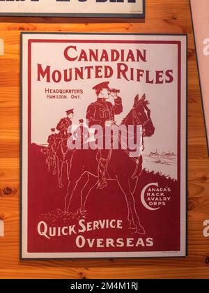 'Canadian Mounted Rifles. Quick service overseas' WWI recruitment poster in the Imperial War Museum, London, UK. Stock Photo
