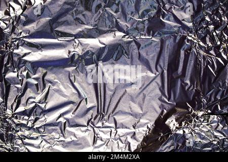 gray crumpled foil as a background close-up Stock Photo