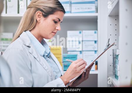 Pharmacist, writing or woman with checklist for medicine stock or medical supplements inventory supply. Pharmacy, clipboard or doctor recording retail Stock Photo