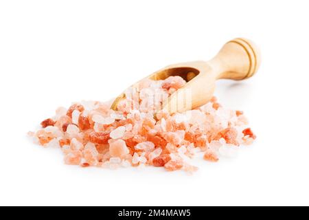 Pink himalayan salt in wooden scoop isolated on the white background. Stock Photo