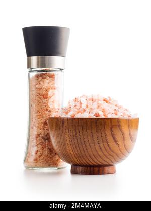 Pink himalayan salt in bowl and salt mill isolated on the white background. Stock Photo