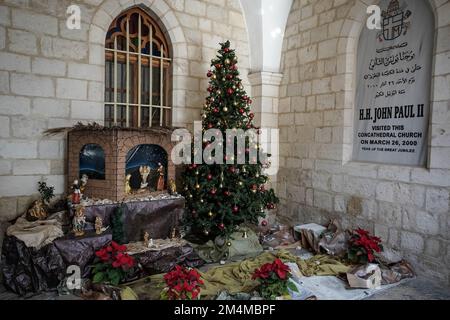 Jerusalem, Israel. 22nd Dec, 2022. A Christmas installation adorns the entrance to the Latin Patriarchate of Jerusalem in the Old City's Christian Quarter. Credit: Nir Alon/Alamy Live News