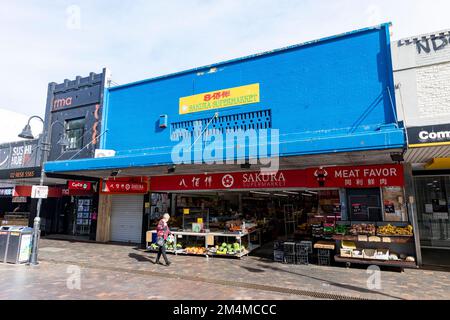 Sakura asian supermarket store in Eastwood town centre,Sydney,NSW,Australia with middle aged lady walking past Stock Photo