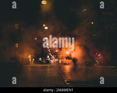 steam over night city street Stock Photo