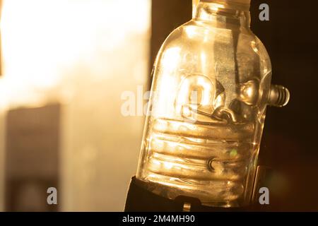 Close up vintage light bulb shine indoors isolated. Concept innovation and new ideas background mock up Stock Photo
