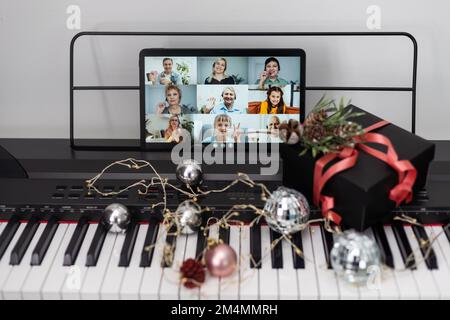 Christmas video call tablet. synthesizer, piano keys Stock Photo