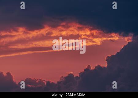 Pink sky hole in the stormy clouds Stock Photo