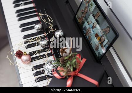 Christmas video call tablet. synthesizer, piano keys Stock Photo