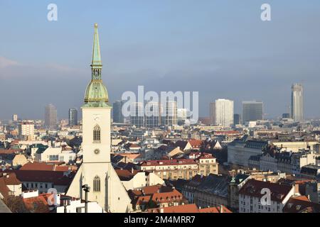 BRATISLAVA, SLOVAKIA - DECEMBER 18, 2022: Cityscape skyline view from the castle with the cathedral and skyscrapers. Stock Photo