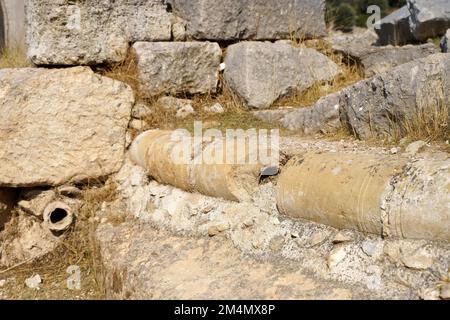 Ancient city of Xanthos in Turkey. Ancient plumbing from the era of the Roman Empire. Ruins of ancient Greek civilization, stone objects of culture and art. High quality photo Stock Photo