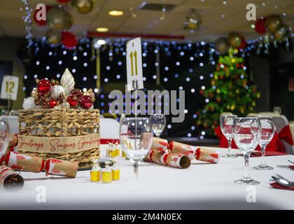 Dining table set set up for Christmas party event during festive season in UK Stock Photo