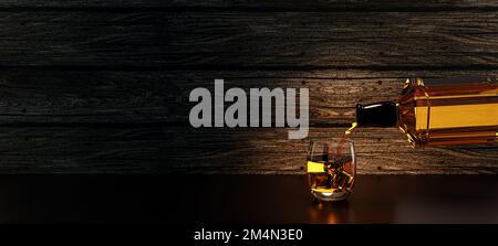 bottle of whiskey / brandy being poured pouring into a glass with ice cubes scotch on the rocks backlit against a wood wooden board background Stock Photo