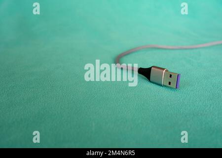 USB cable isolated on green background Stock Photo