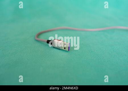USB cable isolated on green background Stock Photo