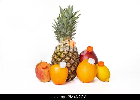Fruits with a mouthpiece on a white background, to drink them as a juice bottle, pineapple, apple, persimon, orange, mango and lemon. Stock Photo