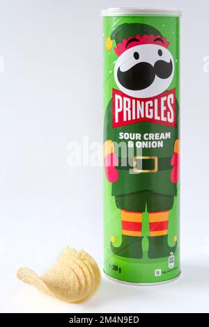 A Christmas themed tub of Sour Cream & Onion flavoured Pringles potato crisps. Stock Photo