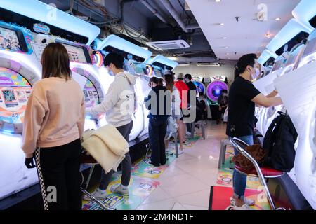 People playing Maimai DX Universe Plus at GameZone in Mong Kok on December 4, 2022 Stock Photo