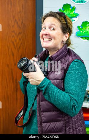 A smiling female photographer. Stock Photo