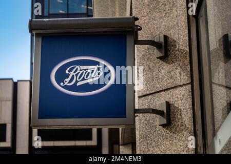 London- September 2022: Boots logo outside branch in Westminster- British high street pharmaceuticals & beauty retailer Stock Photo