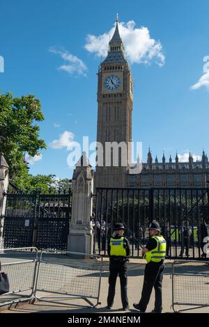 London- September 2022: Big Ben / Houses of Parliament guarded by police Stock Photo